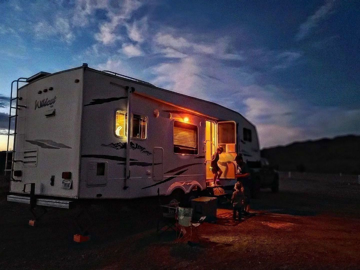 Family at RV in warm evening light at Marysvale RV Park